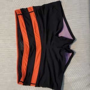 Athleta size small athletic swim shorts with Coral stripes around waist